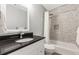 Neutral bathroom with a tub, shower, and decorative tiling at 7047 Bennington Ln, Cumming, GA 30041