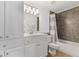 Bathroom boasts a tiled shower, ample cabinet space and vanity at 7047 Bennington Ln, Cumming, GA 30041