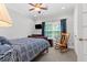 Comfortable bedroom with rocking chair and natural light at 7047 Bennington Ln, Cumming, GA 30041