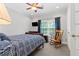 Bedroom features a ceiling fan, rocking chair, and beautiful natural light at 7047 Bennington Ln, Cumming, GA 30041