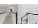 Light and airy hallway overlooking the main level at 7047 Bennington Ln, Cumming, GA 30041