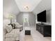 Bright living room with vaulted ceiling and cozy seating at 7047 Bennington Ln, Cumming, GA 30041
