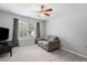 Cozy living room with a comfortable sofa, carpet and lots of natural light at 7047 Bennington Ln, Cumming, GA 30041