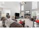 Spacious living room with a soaring ceiling, fireplace, and comfortable seating for relaxed living at 7047 Bennington Ln, Cumming, GA 30041