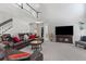 Expansive living room with two-story ceiling, plush carpeting, and ample seating for relaxation at 7047 Bennington Ln, Cumming, GA 30041