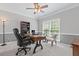 Home office with a ceiling fan, a large window for natural light, and comfortable seating at 7047 Bennington Ln, Cumming, GA 30041