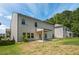Backyard with a covered patio and green grass offers a great space for relaxation and recreation at 18 Dorothy Ln, Lawrenceville, GA 30046