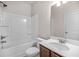 Bright bathroom featuring a bathtub-shower combo and a single sink vanity with a classic design at 18 Dorothy Ln, Lawrenceville, GA 30046