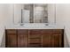 Bright bathroom features a double sink vanity with dark wood cabinets and a tiled shower at 18 Dorothy Ln, Lawrenceville, GA 30046