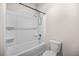 Full bathroom with a shower and tub combination with a white surround and modern fixtures at 18 Dorothy Ln, Lawrenceville, GA 30046