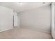 Carpeted bedroom with a window and neutral paint offers a bright, relaxing space at 18 Dorothy Ln, Lawrenceville, GA 30046