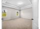 Spacious bedroom with tray ceilings, neutral carpet and large windows for plenty of natural light at 18 Dorothy Ln, Lawrenceville, GA 30046