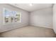 Spacious bedroom featuring a large window with neighborhood views and ample natural light at 18 Dorothy Ln, Lawrenceville, GA 30046
