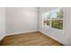 Cozy bedroom with hardwood floors, a large window, and neutral paint at 18 Dorothy Ln, Lawrenceville, GA 30046