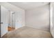Bright, carpeted bedroom with a window, a closet, and a neutral color scheme at 18 Dorothy Ln, Lawrenceville, GA 30046