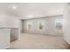 Large bonus room with carpet, neutral walls and natural light from the many windows at 18 Dorothy Ln, Lawrenceville, GA 30046