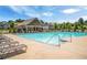 Inviting community pool featuring lounge chairs for relaxation and a clear blue sky overhead at 18 Dorothy Ln, Lawrenceville, GA 30046