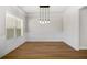 Bright dining room featuring hardwood floors, wainscoting, and stylish pendant lighting at 18 Dorothy Ln, Lawrenceville, GA 30046