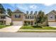 Charming two-story home featuring a brick facade, attached two-car garage, and well-manicured front lawn at 18 Dorothy Ln, Lawrenceville, GA 30046