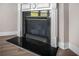 Modern fireplace featuring a black granite surround and sleek mantel at 18 Dorothy Ln, Lawrenceville, GA 30046