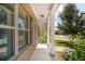 Inviting front porch with brick accents, white pillars, and blooming hydrangea bushes at 18 Dorothy Ln, Lawrenceville, GA 30046