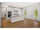 Modern kitchen with white cabinets, stainless steel appliances, granite countertops and an exterior door at 18 Dorothy Ln, Lawrenceville, GA 30046