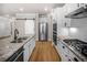Modern kitchen featuring granite countertops, stainless steel appliances, and wood flooring at 18 Dorothy Ln, Lawrenceville, GA 30046