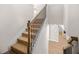 Carpeted stairway with wood and metal banister leading to another level with hardwood floors at 18 Dorothy Ln, Lawrenceville, GA 30046