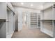 Spacious walk-in closet with custom shelving and ample storage space for an organized wardrobe at 18 Dorothy Ln, Lawrenceville, GA 30046