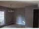 Inviting dining area with hardwood floors, modern lighting, and French doors leading to the outdoors at 272 Toweridge Dr, Marietta, GA 30064