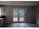 Bright dining area featuring hardwood floors, contemporary lighting, and a door offering a view of lush greenery at 272 Toweridge Dr, Marietta, GA 30064