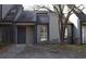 Modest home featuring muted tones, a simple entry, and natural landscaping in a quiet residential neighborhood at 272 Toweridge Dr, Marietta, GA 30064