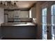 Updated kitchen with white cabinets, stainless steel appliances, and a view to the outdoor deck at 272 Toweridge Dr, Marietta, GA 30064