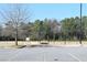 Open parking lot area with mature trees and landscaping around Tumlin Park at 272 Toweridge Dr, Marietta, GA 30064