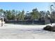 Fenced-in tennis courts with mature trees surrounding the Tumlin Park community at 272 Toweridge Dr, Marietta, GA 30064