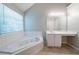 Relax in the luxurious soaking tub featured in the spacious bathroom at 3283 Sugar Creek Falls Se Ave, Atlanta, GA 30316