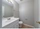 Bathroom with white vanity, neutral walls, toilet, and towel rack at 3283 Sugar Creek Falls Se Ave, Atlanta, GA 30316