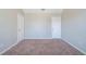 Spacious bedroom featuring plush carpeting and two doors at 3283 Sugar Creek Falls Se Ave, Atlanta, GA 30316