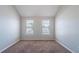 Bright bedroom features two large windows for ample natural light at 3283 Sugar Creek Falls Se Ave, Atlanta, GA 30316