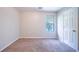 Cozy bedroom featuring plush carpeting, window with blinds and fresh paint at 3283 Sugar Creek Falls Se Ave, Atlanta, GA 30316