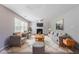 Comfortable living room with cozy seating, fireplace, and neutral decor, perfect for relaxation and entertaining at 3283 Sugar Creek Falls Se Ave, Atlanta, GA 30316