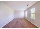 Spacious living room with plush carpet and lots of natural light at 3283 Sugar Creek Falls Se Ave, Atlanta, GA 30316
