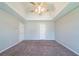 The unfurnished main bedroom features a tray ceiling and neutral carpet at 3283 Sugar Creek Falls Se Ave, Atlanta, GA 30316