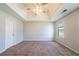 The unfurnished main bedroom features a tray ceiling and neutral carpet at 3283 Sugar Creek Falls Se Ave, Atlanta, GA 30316