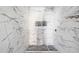 Modern bathroom showcasing elegant marble-style tiling and sleek finishes at 3845 Springleaf Ct, Stone Mountain, GA 30083