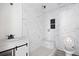 Bright bathroom featuring tiled shower, modern fixtures, and hexagon tile inset at 3845 Springleaf Ct, Stone Mountain, GA 30083