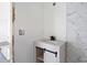 Modern bathroom vanity with white cabinets and striking marble countertop at 3845 Springleaf Ct, Stone Mountain, GA 30083