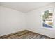 Bedroom with wood-look flooring and a window with neighborhood views at 3845 Springleaf Ct, Stone Mountain, GA 30083