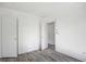 Empty bedroom with wood-look floors and closet at 3845 Springleaf Ct, Stone Mountain, GA 30083