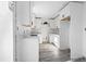 Modern kitchen features white cabinets, sleek countertops, and durable flooring throughout open design at 3845 Springleaf Ct, Stone Mountain, GA 30083